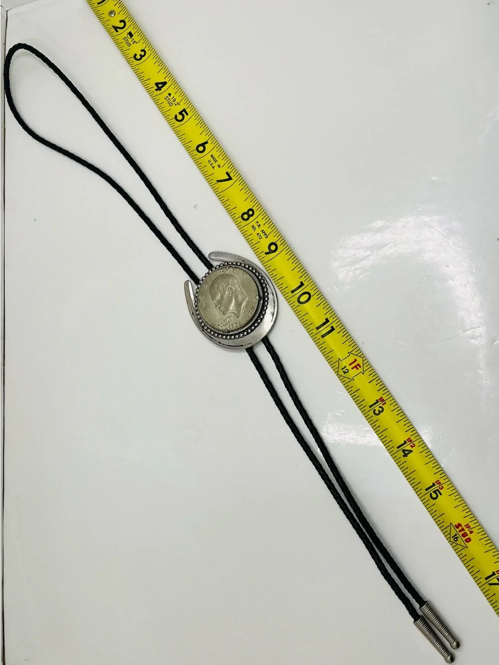 Black Braided Leather Bolo Tie with Silver Horseshoe and Coin Medallion